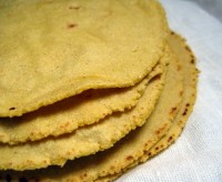 A stack of homemade corn tortillas